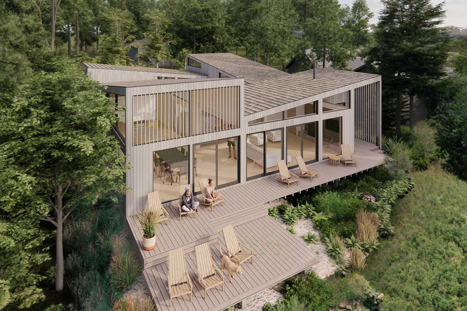 Skycatcher-Michigan-Lakehouse5a Aerial view of Skycatcher showing the pinwheel roof geometry, interconnected outdoor decks, and surrounding wooded hillside.